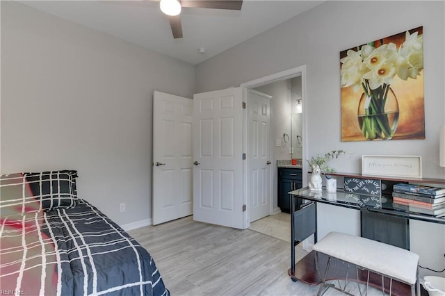 bedroom featuring ensuite bathroom, ceiling fan, and light hardwood / wood-style floors