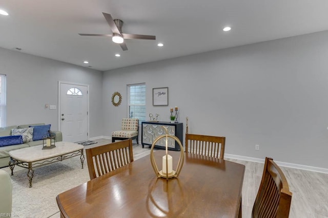 dining space featuring light hardwood / wood-style floors and ceiling fan