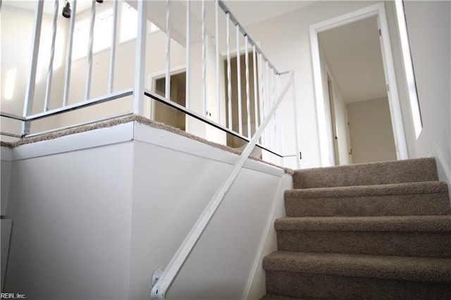 stairway featuring a healthy amount of sunlight