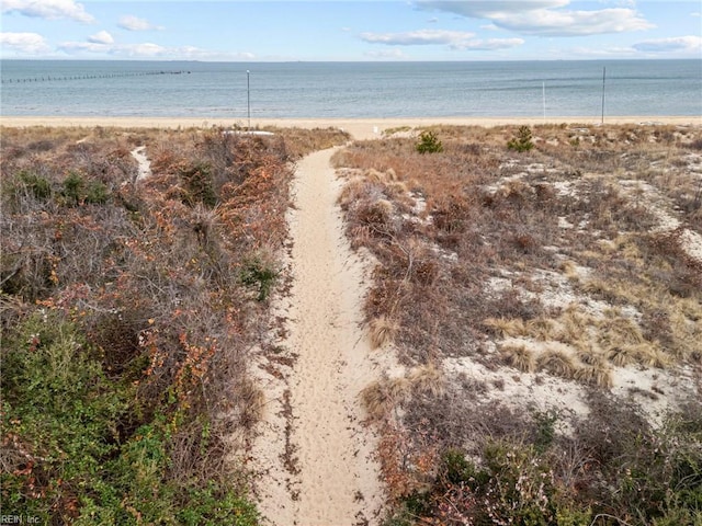 property view of water featuring a beach view