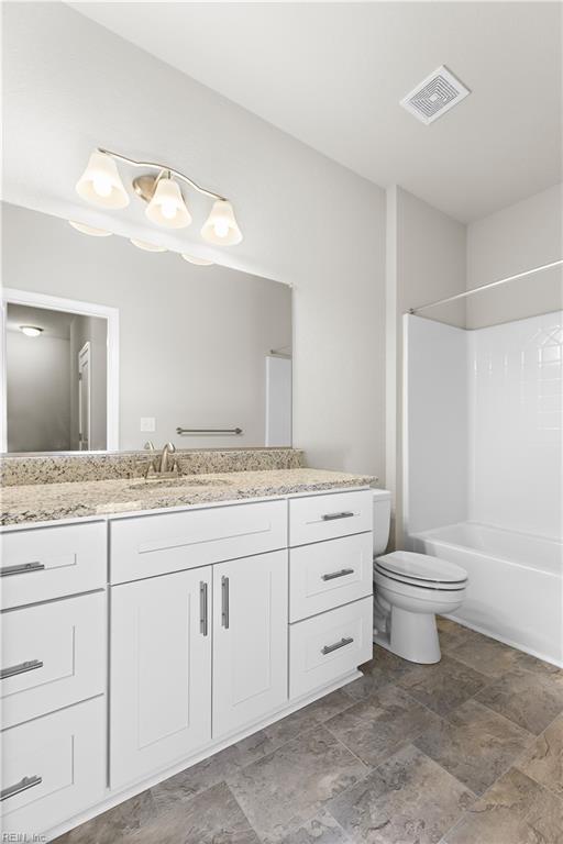 full bathroom featuring vanity, toilet, and tub / shower combination