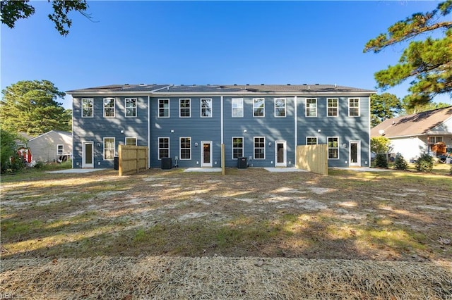 colonial home featuring cooling unit