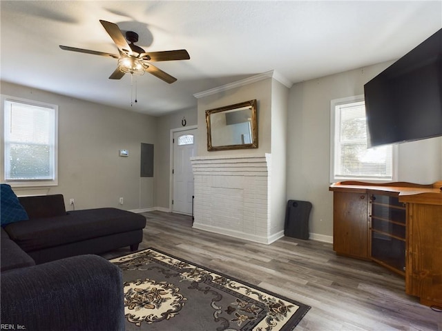 living room with hardwood / wood-style flooring, plenty of natural light, and ceiling fan