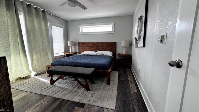 bedroom with ceiling fan and dark hardwood / wood-style flooring