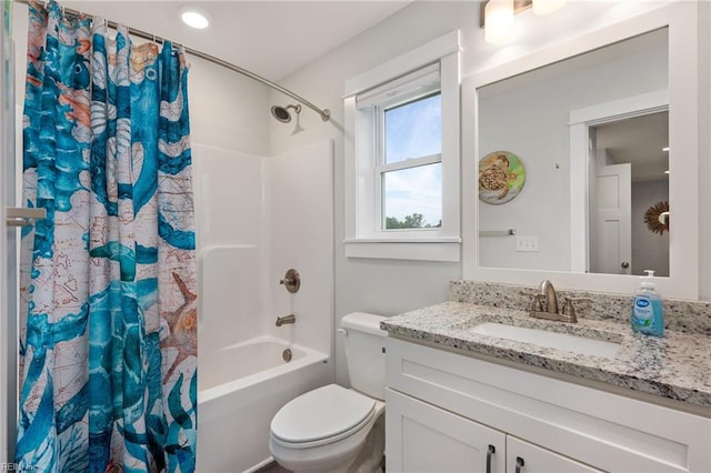 full bathroom featuring vanity, shower / bath combination with curtain, and toilet