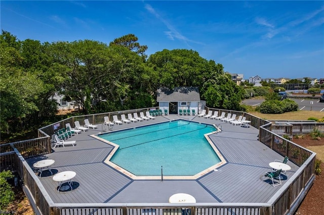 view of swimming pool with an outdoor structure