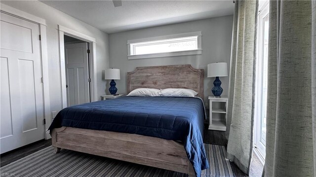 bedroom with hardwood / wood-style floors and ceiling fan