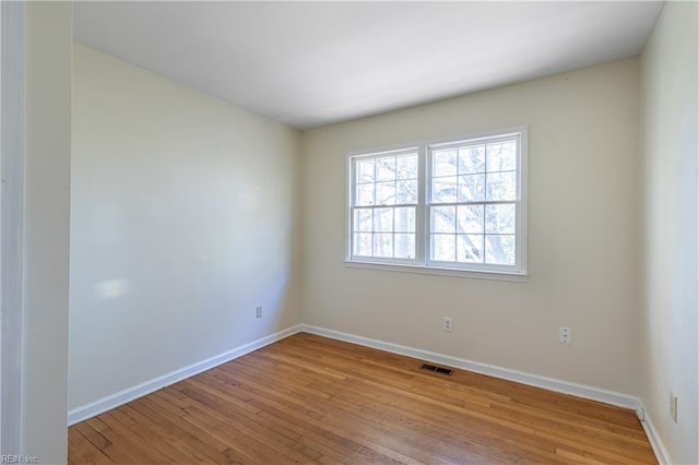 unfurnished room featuring light hardwood / wood-style floors