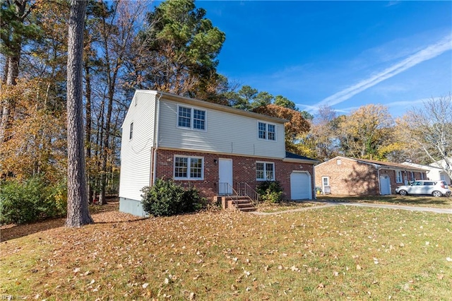 view of front property with a garage and a front lawn