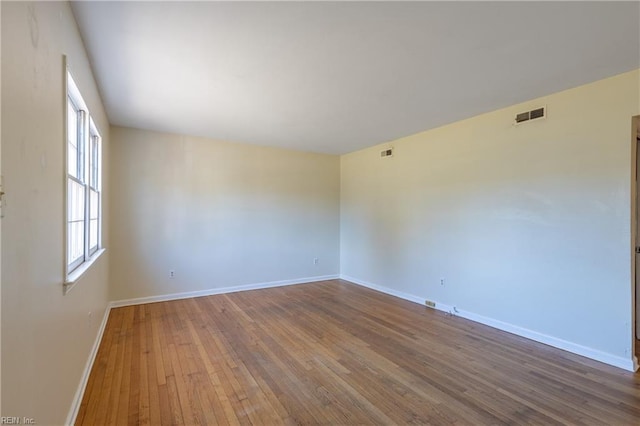 unfurnished room featuring wood-type flooring