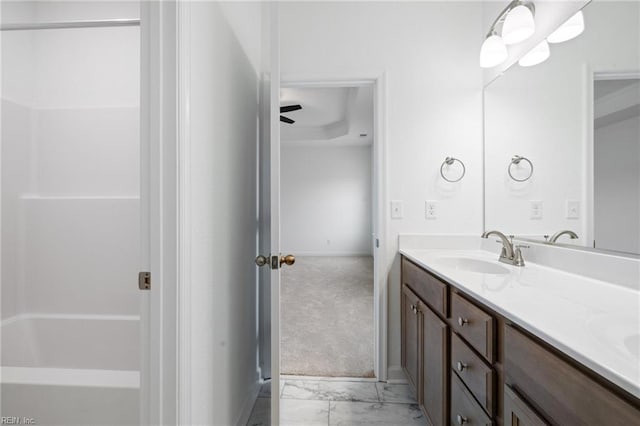 bathroom featuring ceiling fan and vanity