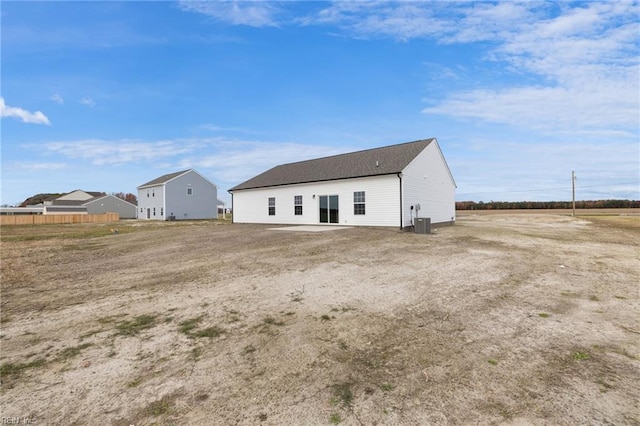 back of property with central AC