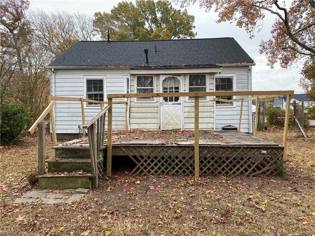 86 Cavalier Rd, Hampton, VA 23669 - back of property featuring a shingled roof and a wooden deck