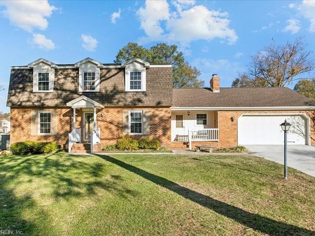 view of front of property with a garage and a front yard