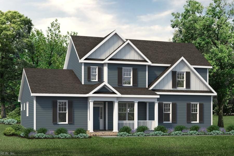 craftsman house with covered porch and a front yard