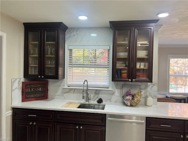 bar with decorative backsplash, a wealth of natural light, sink, and stainless steel dishwasher