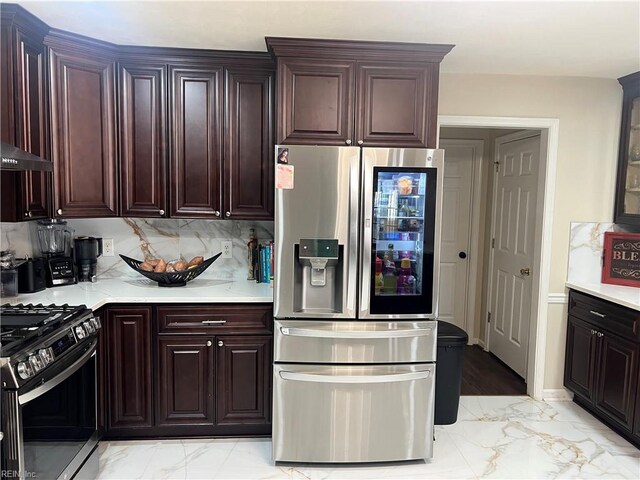 kitchen with decorative backsplash, wall chimney range hood, and stainless steel appliances