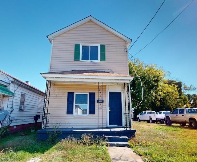 view of front of property featuring a porch and a front yard