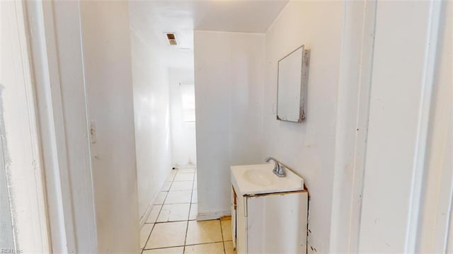 bathroom with tile patterned floors and vanity