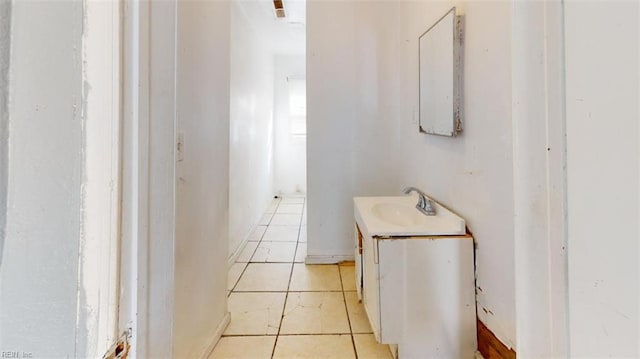 bathroom featuring tile patterned flooring and vanity