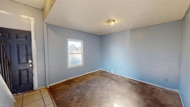 view of carpeted entrance foyer