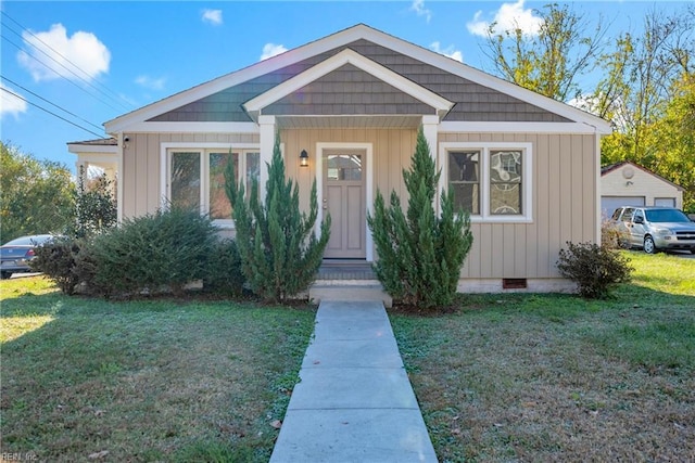 view of front of home with a front lawn