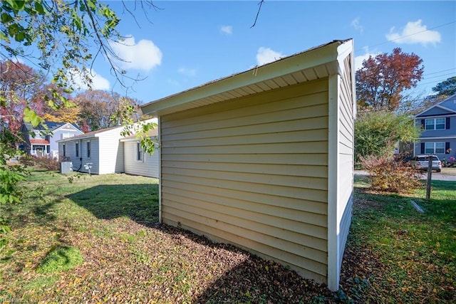 view of property exterior with a lawn