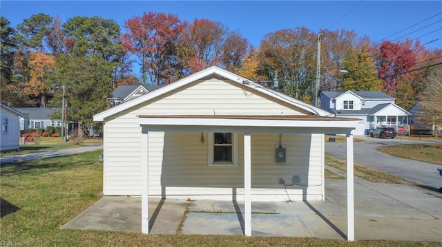 view of outbuilding featuring a yard