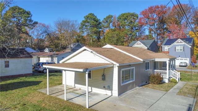 back of property featuring a lawn