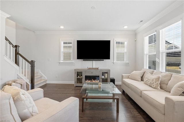 living room with ornamental molding and dark wood-type flooring