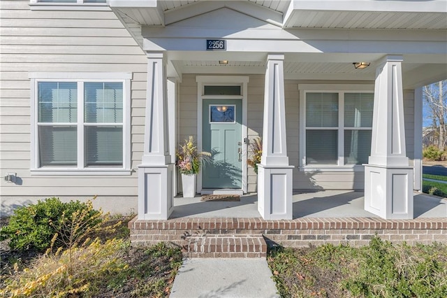 property entrance with covered porch