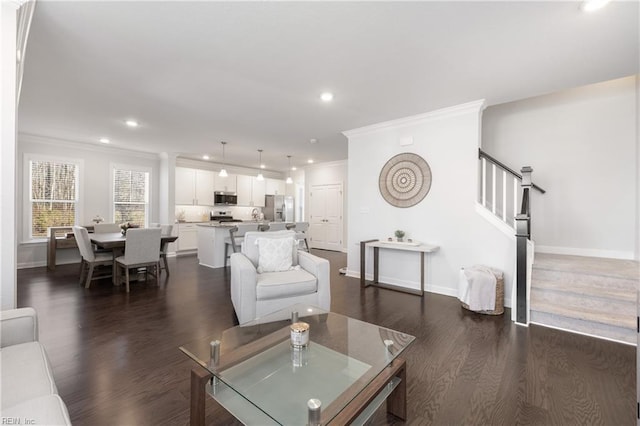 living room featuring dark hardwood / wood-style flooring and ornamental molding