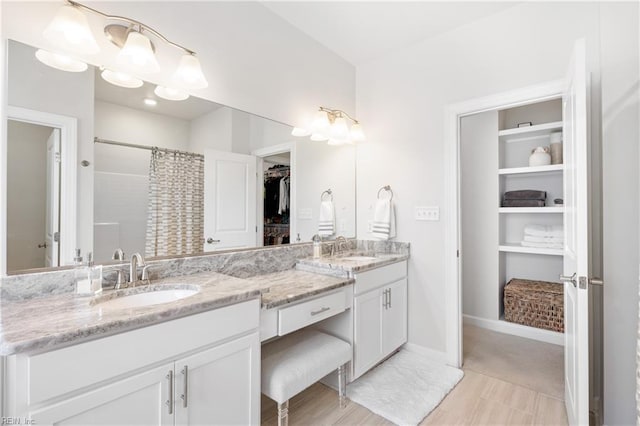 bathroom with vanity and a shower with shower curtain