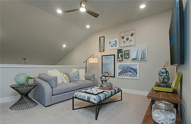 carpeted living room featuring vaulted ceiling and ceiling fan