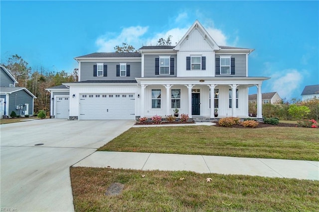 view of front of property featuring a front lawn, a porch, and a garage