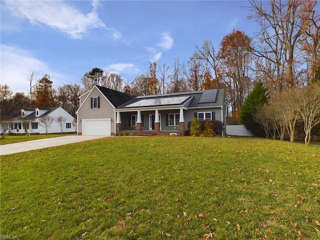 ranch-style house featuring solar panels, a garage, covered porch, and a front lawn