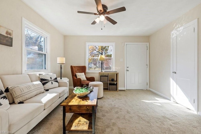 carpeted living room featuring ceiling fan