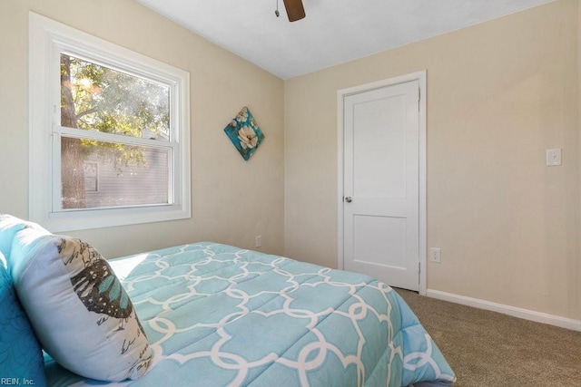 carpeted bedroom with ceiling fan