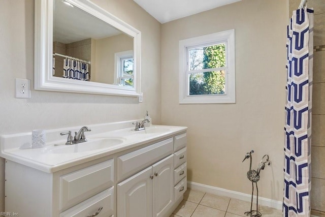 bathroom featuring tile patterned flooring, vanity, and curtained shower