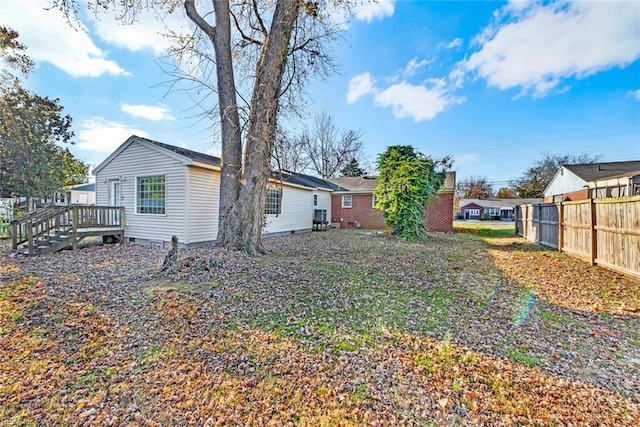 back of property featuring a wooden deck