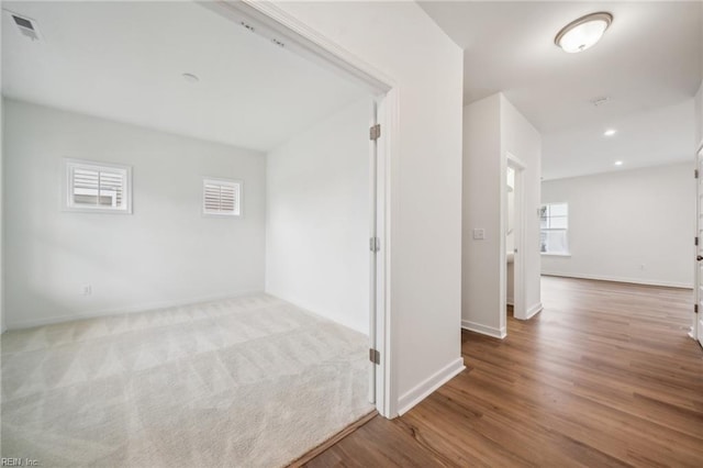 hallway with light wood-type flooring