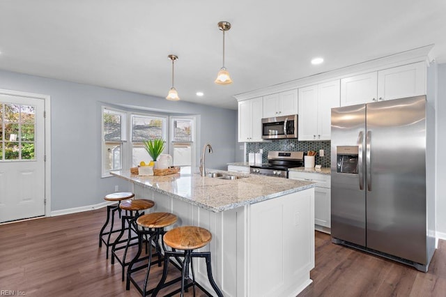 kitchen with white cabinets, sink, and appliances with stainless steel finishes