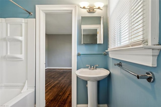 bathroom featuring shower / bathing tub combination and wood-type flooring