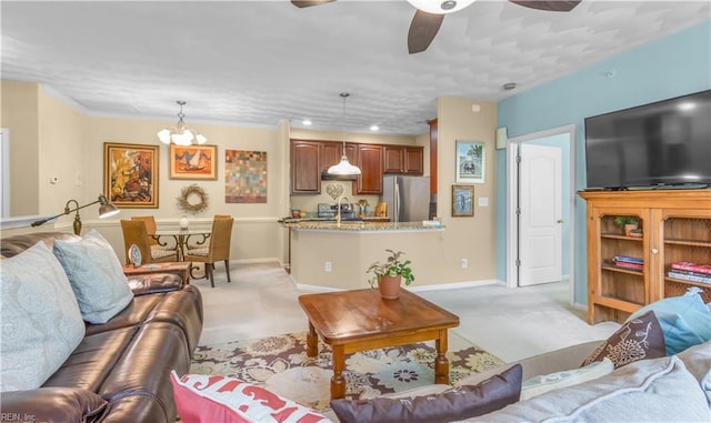 carpeted living room featuring sink and an inviting chandelier