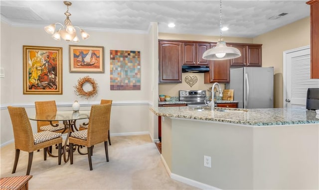 kitchen with appliances with stainless steel finishes, light colored carpet, crown molding, decorative light fixtures, and an inviting chandelier