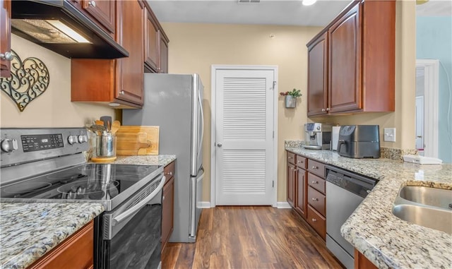 kitchen featuring ventilation hood, light stone countertops, dark hardwood / wood-style floors, and appliances with stainless steel finishes