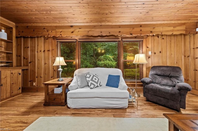 living area featuring wood walls, wooden ceiling, and light hardwood / wood-style flooring