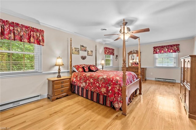 bedroom with ceiling fan, ornamental molding, a baseboard radiator, and light wood-type flooring