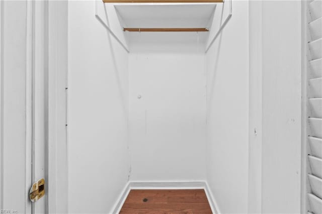 spacious closet featuring hardwood / wood-style flooring