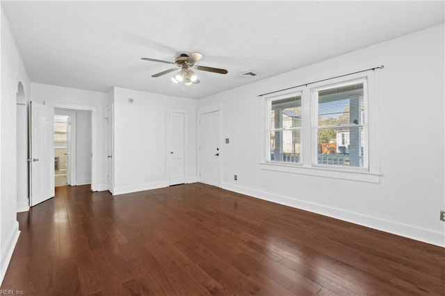 interior space with dark hardwood / wood-style floors and ceiling fan